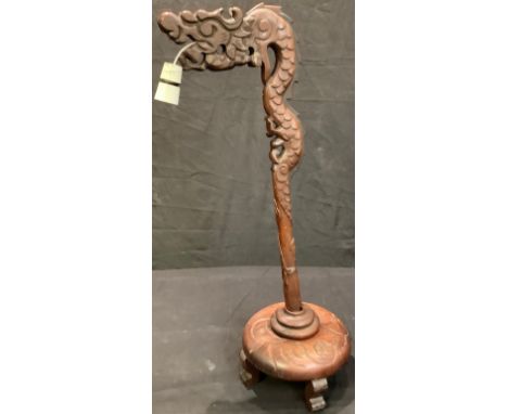A Chinese hardwood table lamp, carved and pieced as a  dragon, 71cm high 