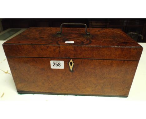 A Victorian figured walnut tea caddy with ivory escutcheon