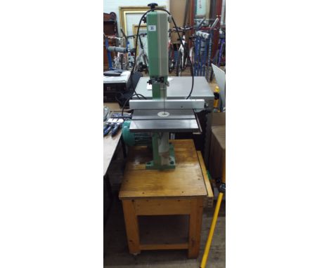 A Inca Band saw on a wooden base with drawer, model number 342-186.