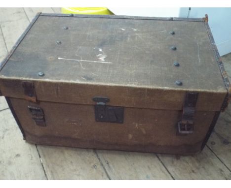 A small canvas cabin trunk 