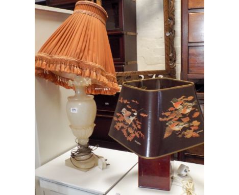 A large alabaster table lamp and another with bird decorated lamp shade