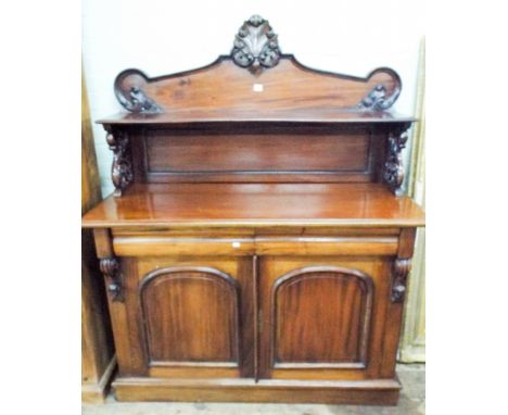 A mahogany reproduction chiffonier with shelf back drawers and cupboards under  