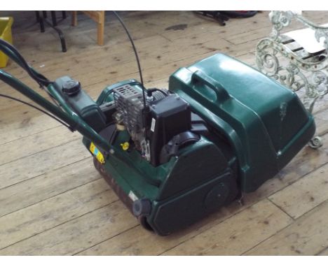 A Balmoral 17SE petrol engine cylinder self propelled lawn mower with electric start in working order 