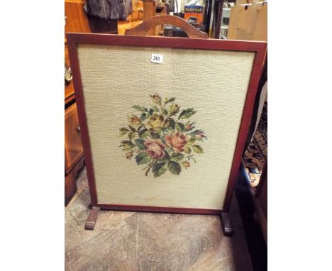 A mahogany framed tapestry panel fire screen 