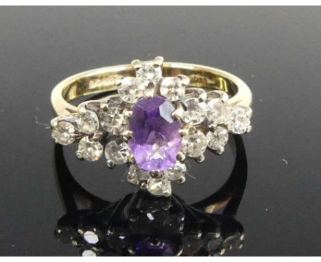 A contemporary 9ct gold amethyst and diamond set cluster ring, the lozenge setting measuring approx 16 x 11mm, size K, 2.6g
