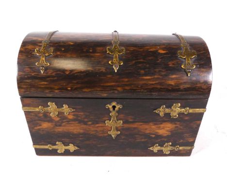 A Victorian coromandel and brass bound dome-top stationery box, w.22cmSplits and repairs to lid.Mounts a little bent in place