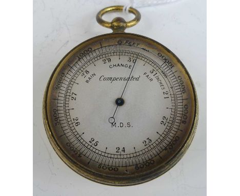 A gilt metal cased pocket barometer, having unsigned silvered dial, housed in an outer leather travel case