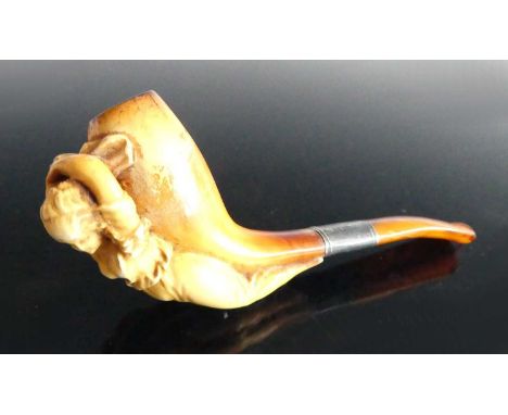 A 19th century meerschaum pipe, the bowl carved as a nautical ship's figurehead, having an white metal collar, 11cm, together