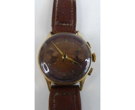 A vintage 18ct gold cased Swiss chronograph gent's wristwatch, the signed dial having luminous Arabic markers, twin sub dials