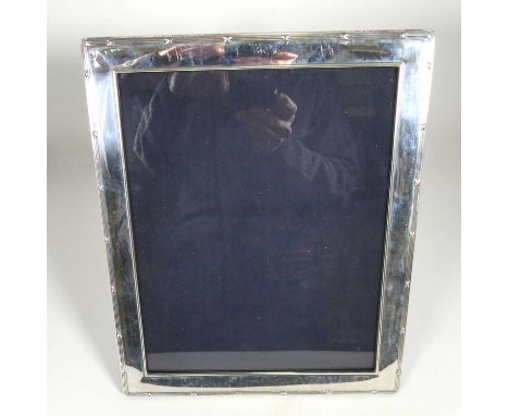 An Elizabeth II Carr's silver-clad easel photograph frame, 25 x 20cm