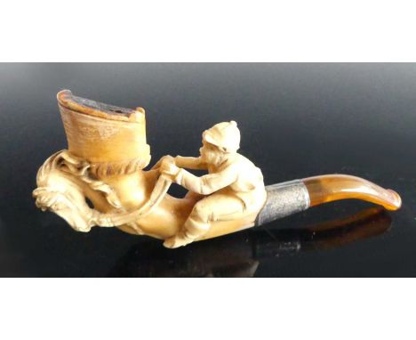 A 19th century meerschaum pipe, the bowl carved as a racing jockey, having an white metal collar, 10cm, together with two oth