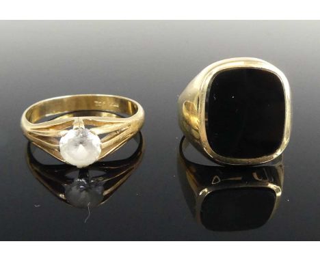 A gent's yellow metal and polished jet set signet ring, unmarked but tests as approx 9ct gold, size R; together with a gent's