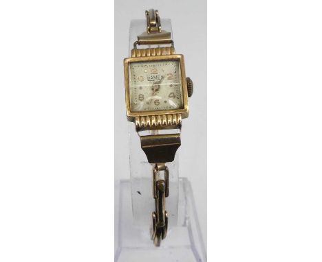A lady's Art Deco Ramex 18ct gold cased manual wind wristwatch, on gilt metal expanding link bracelet