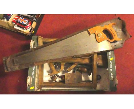 A wooden boxed carpenter's cased tool set with various saws, angles, etc