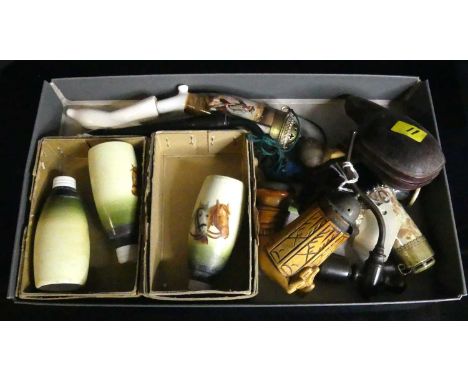 A carved meerschaum pipe in the form of a stag in a tooled leather case, together with various continental smoking pipe bowls
