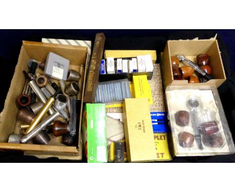 A box of various pipe smoking paraphernalia to include bowls, spare stems, and gift sets, The Brymaster, The Phoenix Triplet 