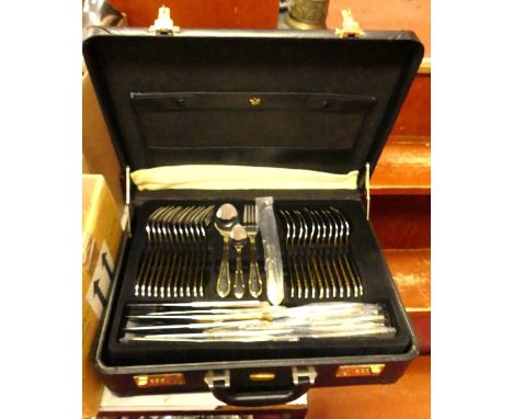 An Edelstahl Solingen parcel-gilt silver plated canteen of cutlery, 12-place setting, in a fitted simulated leather briefcase