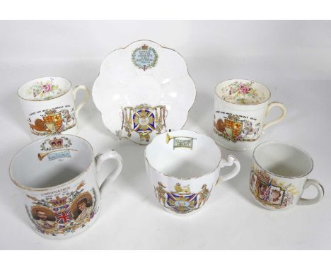 A Charles Wileman Boer War commemorative cup and saucer; together with a pair of Charles Wileman Victorian commemorative mugs