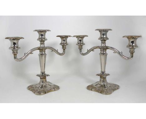 A pair of silver plated three-branch table candelabra, having cast vine decoration, h.25cm 