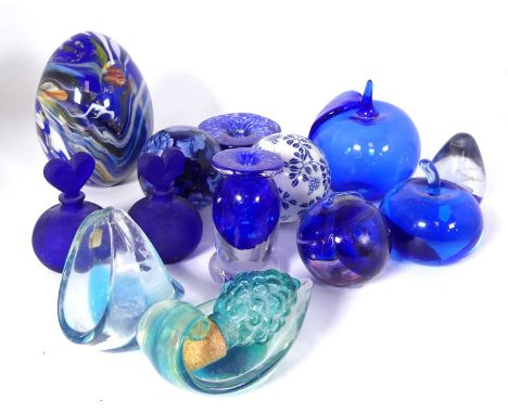 A collection of ceramics and glass ware to include paperweights, carpet bowls, and scent bottle