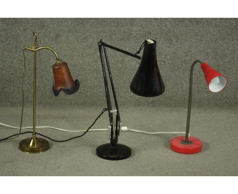 A Herbert Terry style black Anglepoise desk lamp, together with a mid to late 20th century red adjustable desk lamp, and an E