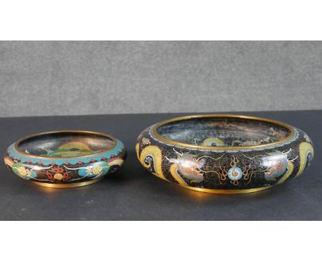 A large Meji period Japanese cloisonné enamel dragon and flaming pearl bowl along with a smaller dragon bowl. Four character 