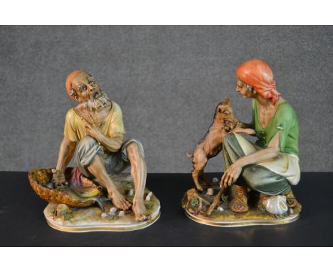 A pair of Italian Capodimonte porcelain figures, depicting a man seated with a basket of fish and a lady playing with a kid. 