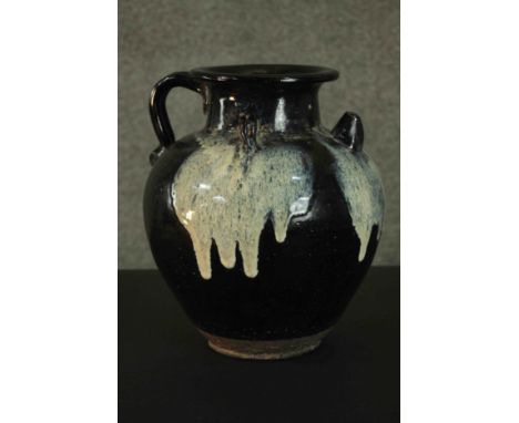 An early Chinese black ware handled ceramic ewer with white splashes. H.31cm. 