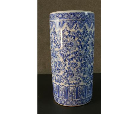 A vintage blue and white Chinese ceramic stylised floral design umbrella stand. Printed character mark to the base. H.46 Diam