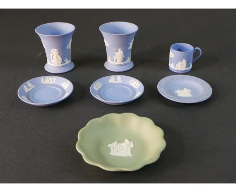 A collection of Wedgwood Jasperware, including two blue and white classical design vases, a coffee cup and saucer, two plates