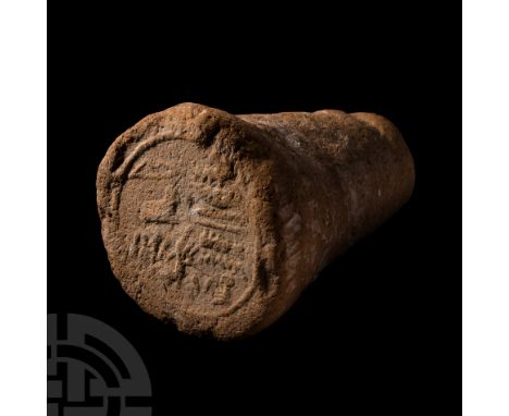 18th Dynasty, circa 1400 B.C. A ceramic funerary cone bearing hieroglyphs in raised relief reading: ?s?r sš mš? n nb t?wy mni
