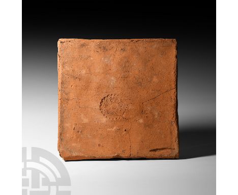 1st-early 4th century A.D. A large, square-shaped ceramic tile stamped to one face with a rosette bearing an inscription, lik