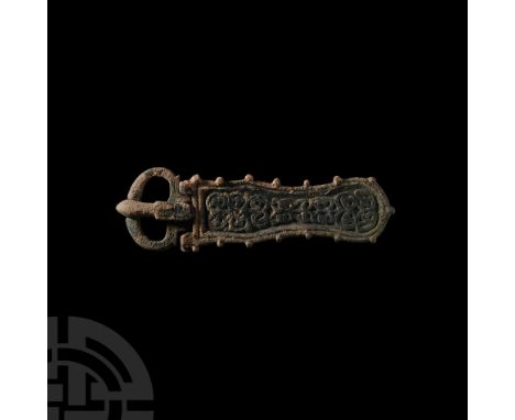 Circa 7th century A.D. A Merovingian or Byzantine buckle with waisted plate with decorative knops to the edge and sinuous ent