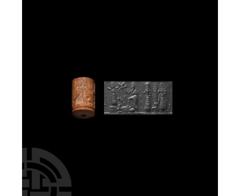 18th-16th century B.C. or later. A cylinder seal with a facing hunting god holding a bow and arrow, a quiver with a long tass