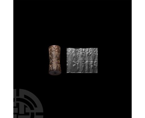 2nd millennium B.C. A large cylinder seal with a double register; the top register with a pair of lions attacking a pair of r