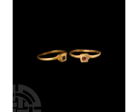 13th century A.D. A slender gold ring composed of a D-section hoop and box bezel flanked by narrow collars decorated with inc