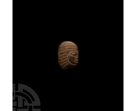 18th Dynasty, 1479-1425 B.C. A carved stone scarab or bead, plano-convex in form with gusset to the outer edge and longitudin