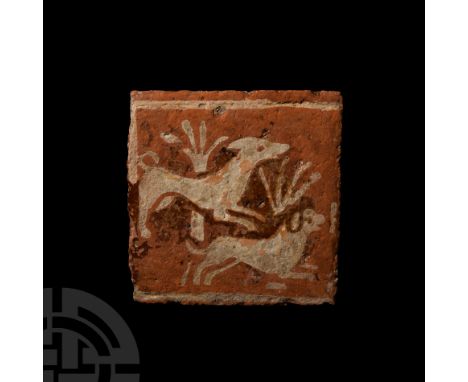 France, possibly Beauvais, late 15th century A.D. A square ceramic tile stamped with a design composed of two hounds running 