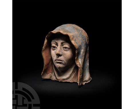 Italy, 15th century A.D. A terracotta head, likely representing Saint Anne, modelled as an older woman wearing a wimple which
