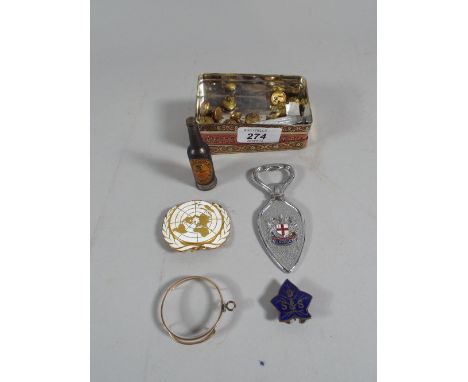 A Continental Tin Containing United Nations Badge, Monocle, Collection of Guinness Buttons, Guinness Cigarette Lighter, Ename