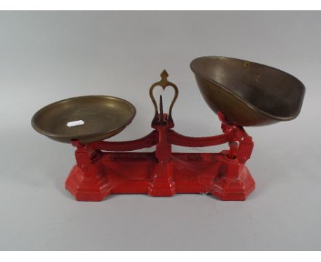A Set of Red Painted Iron Based Kitchen Scales. 