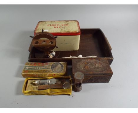 A Wooden Tray Containing Curios To Include Egg Timer, Vintage Toy Jet Engine The Jetex Jet Master, First Aid Tin, Clay Pipes,
