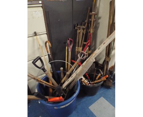 A Large Quantity of Garden and Workshop Tools to Include Forks, Spades, Brushes, Saws, Shears Etc. 
