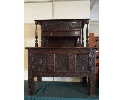 An Oak Three Panelled Coffer with Extended Stiles and Later Carving, Having Raised Gallery Top with Large Long Drawer over Tw