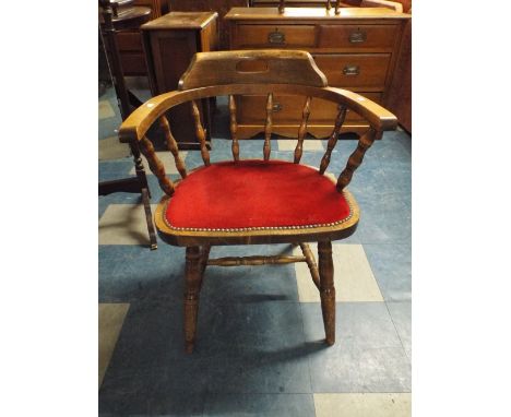 An Edwardian Spindle Back Smokers Bow Style Arm Chair. 