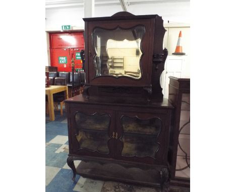 An Art Nouveau Mahogany Parlour Cabinet with Raised Glazed Display Section Having Mirrored Back and Base Cupboard with Glazed