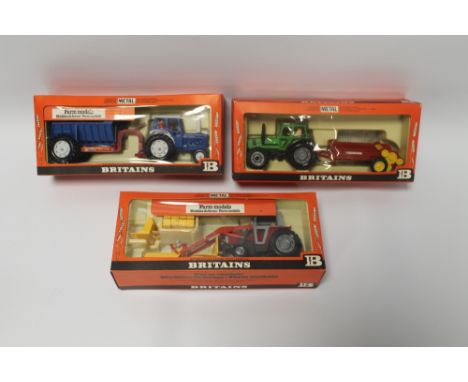 THREE BOXED BRITAINS 1:32 SCALE FARM VEHICLES, to include 9596 Deutz Tractor with Manure Spreader, 9595 Massey Ferguson Tract