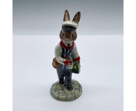 Hand decorated porcelain figure of a bunny delivering bottles of milk. Bunny is shown in a white shirt with red cuffs and col