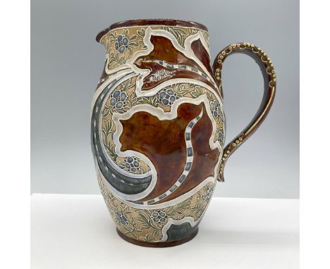 Beautiful glazed pitcher. Features a medium relief Art Nouveau style design. Marked M.V.M. 264. Issued: c. 1878-1912Dimension