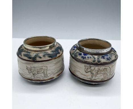 Salt-glazed pots adorned with sterling silver rims, showcasing intricate animal scenes such as cattle's, lions and botanical 